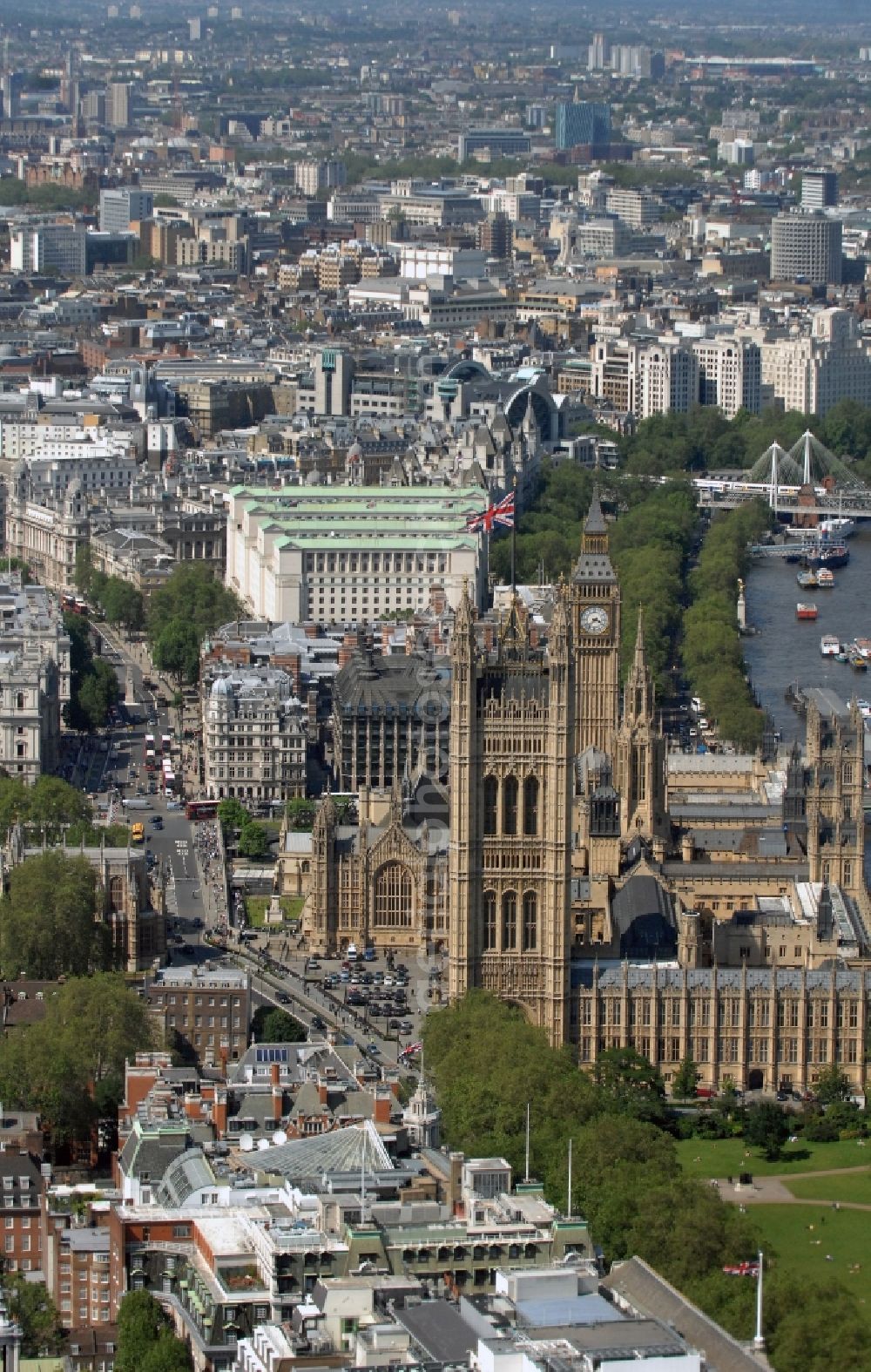 London from above - View of the Palace of Westminster / Westminster Palace in London. monumental, neo-Gothic style building in London where the meeting consists of the House of Commons and the House of Lords, British Parliament. This is under the UNESCO World Heritage landmark located in the City of Westminster on Parliament Square, close to government buildings at Whitehall. The most famous part of the palace is the Clock Tower (Clock Tower), with the bell Big Ben