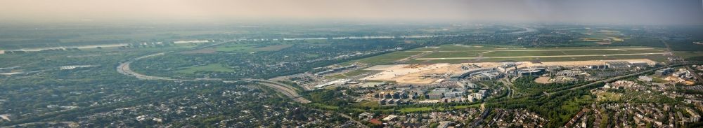 Düsseldorf from above - Panoramic perspective runway with hangar taxiways and terminals on the grounds of the airport in Duesseldorf in the state North Rhine-Westphalia, Germany