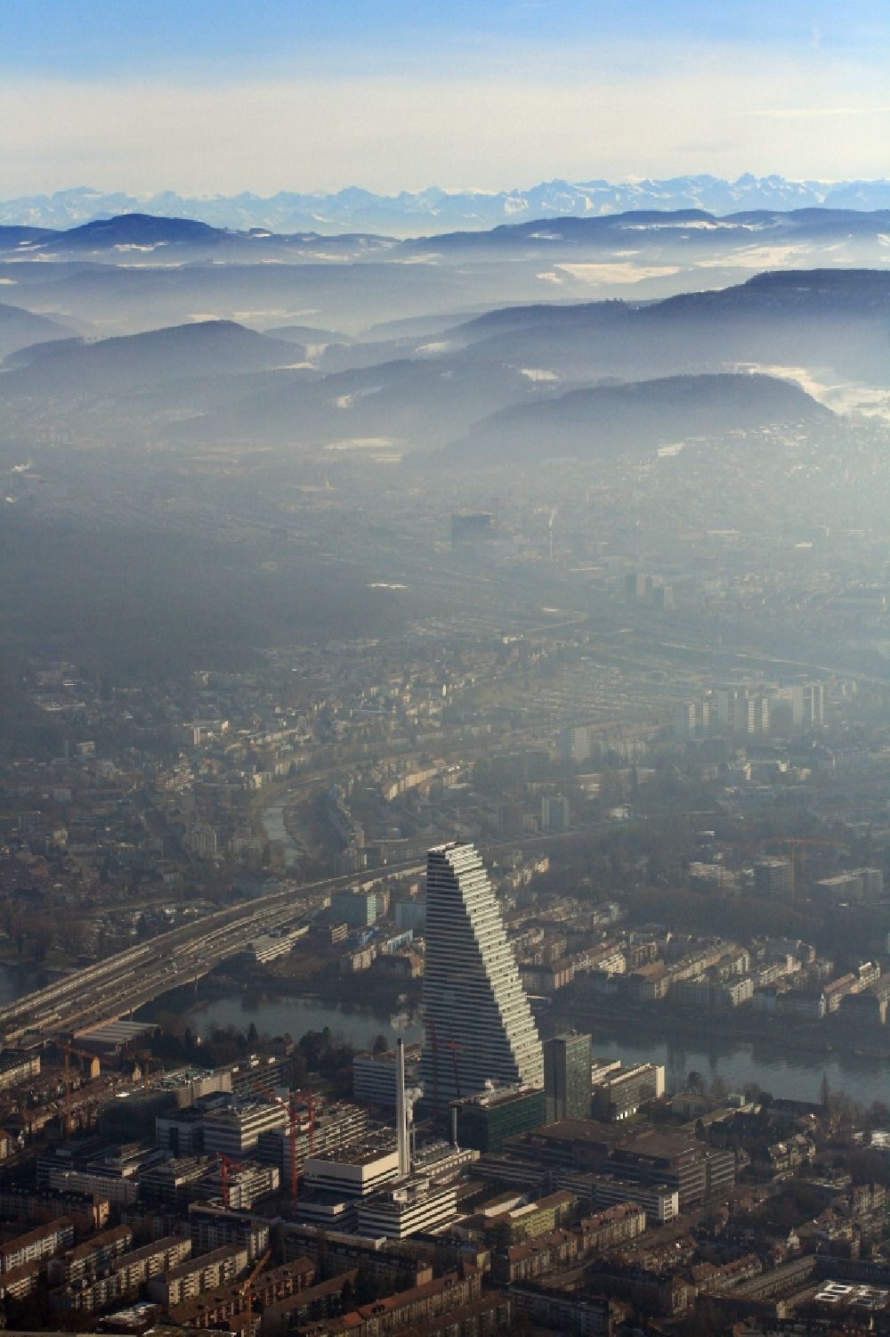 Aerial photograph Basel - Panorama from the local area of Basle in Switzerland, looking to the south over the impressive Roche skyscraper, the Jura mountains to the Swiss alps