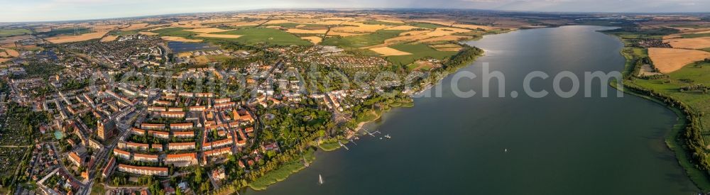 Prenzlau from the bird's eye view: Panoramic perspective of waterfront seaside resort of Prenzlau in the towns in Prenzlau in the Federal State of Brandenburg