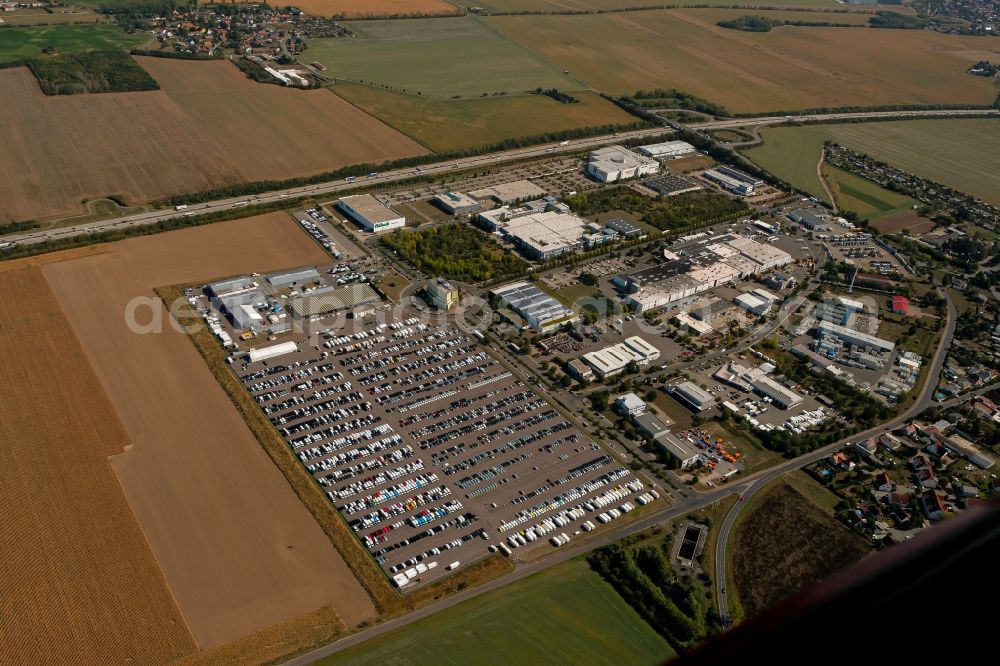 Wiedemar from the bird's eye view: Parking and storage space for automobiles of CARS Technik & Logistik GmbH on Junkerstrasse in Wiedemar in the state Saxony, Germany