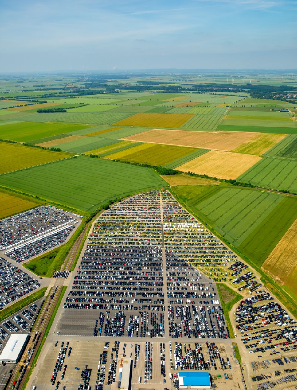 Zülpich from above - Parking and storage space for new cars Automobile in Zuelpich in North Rhine-Westphalia. Operator of the site is the Norwegian - Swedish shipping company Wallenius Wilhelmsen Logistics, which deals mainly with the global transport of cars, trucks and other rolling cargoes
