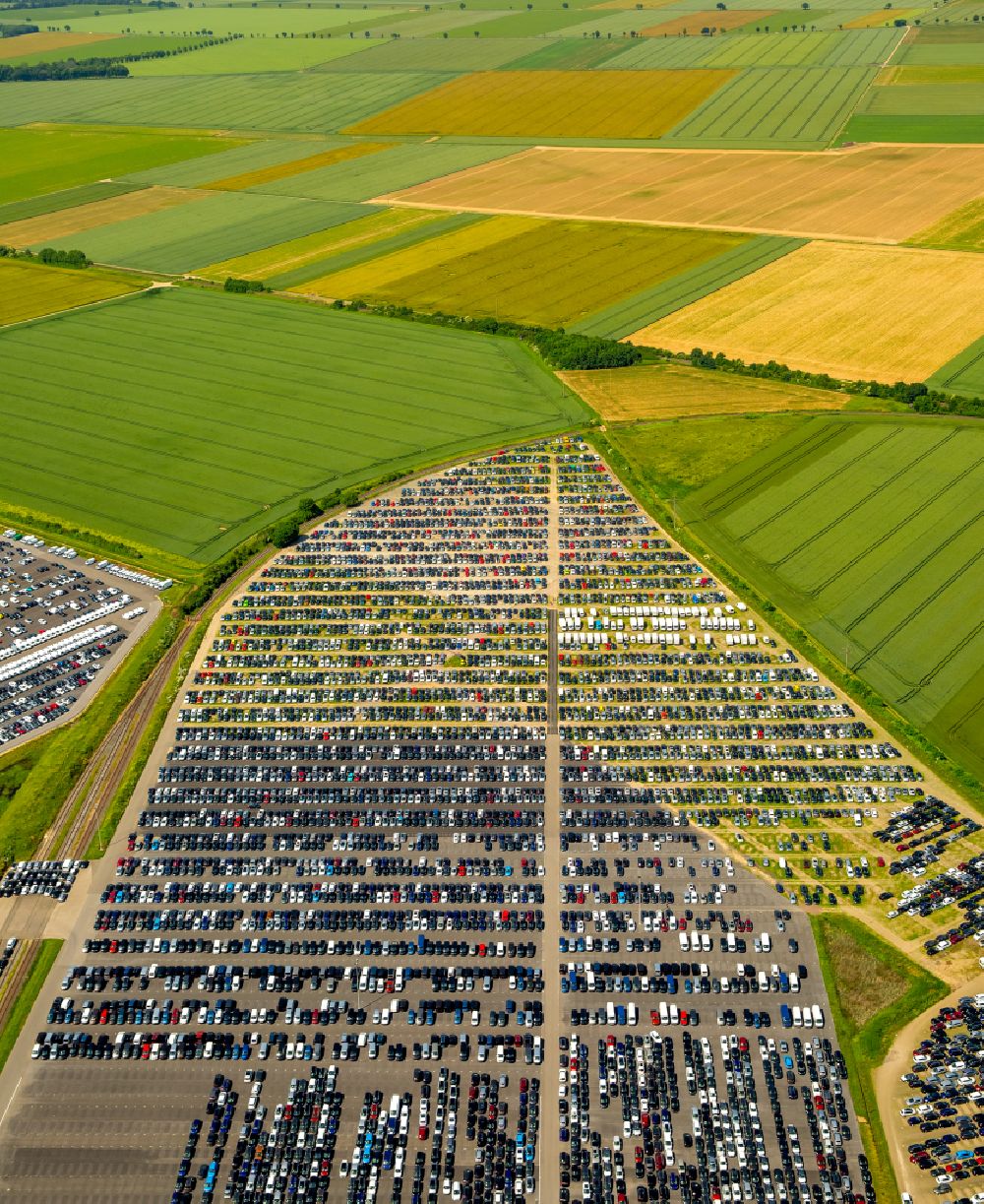 Zülpich from the bird's eye view: Parking and storage space for new cars Automobile in Zuelpich in North Rhine-Westphalia. Operator of the site is the Norwegian - Swedish shipping company Wallenius Wilhelmsen Logistics, which deals mainly with the global transport of cars, trucks and other rolling cargoes