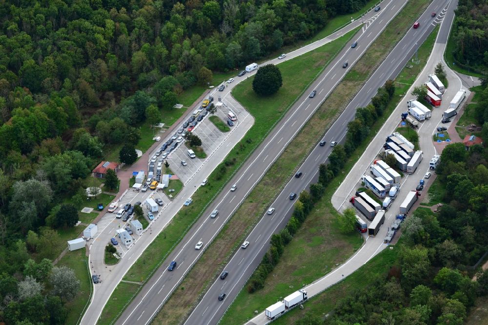 Aerial photograph Neuenburg am Rhein - Motorway service area Neunbur East on the edge of the course of BAB highway A5 with Corona - Teststation for returning travellers in Neuenburg am Rhein in the state Baden-Wuerttemberg, Germany