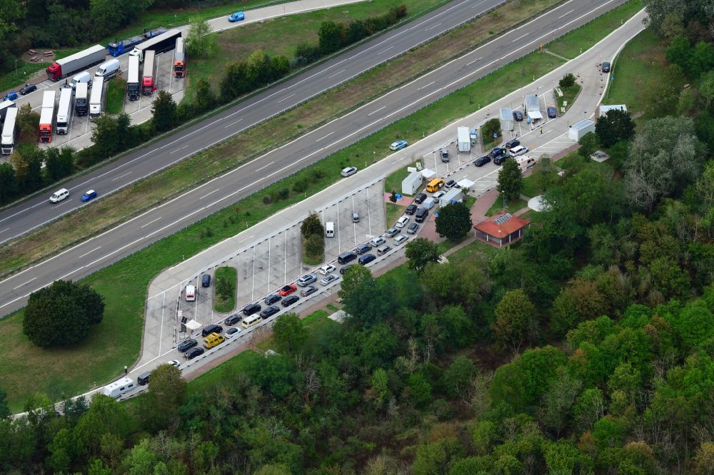 Neuenburg am Rhein from the bird's eye view: Motorway service area Neunbur East on the edge of the course of BAB highway A5 with Corona - Teststation for returning travellers in Neuenburg am Rhein in the state Baden-Wuerttemberg, Germany