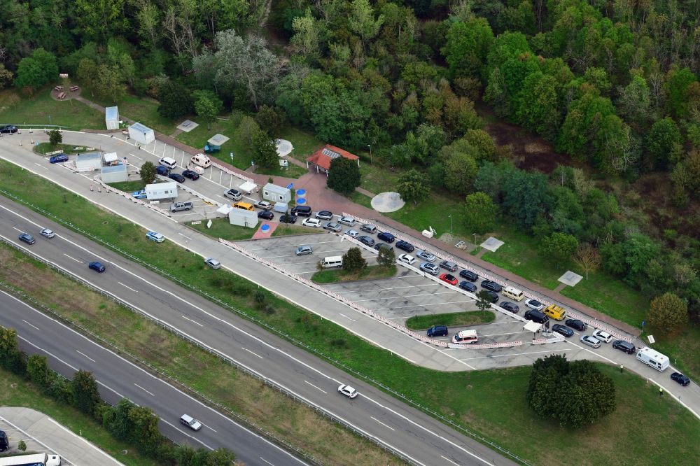 Aerial photograph Neuenburg am Rhein - Motorway service area Neunbur East on the edge of the course of BAB highway A5 with Corona - Teststation for returning travellers in Neuenburg am Rhein in the state Baden-Wuerttemberg, Germany