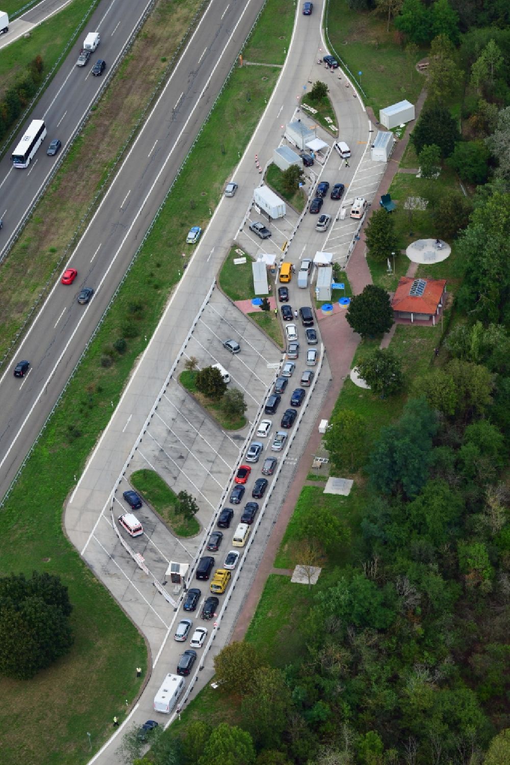 Neuenburg am Rhein from above - Motorway service area Neunbur East on the edge of the course of BAB highway A5 with Corona - Teststation for returning travellers in Neuenburg am Rhein in the state Baden-Wuerttemberg, Germany