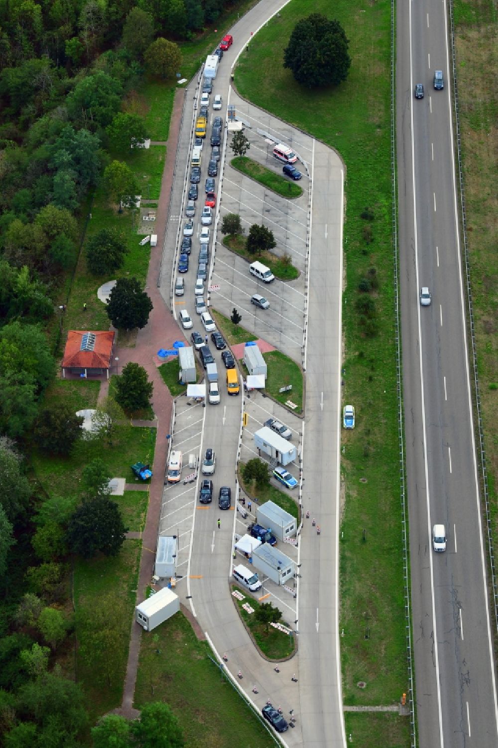 Aerial image Neuenburg am Rhein - Motorway service area Neunbur East on the edge of the course of BAB highway A5 with Corona - Teststation for returning travellers in Neuenburg am Rhein in the state Baden-Wuerttemberg, Germany