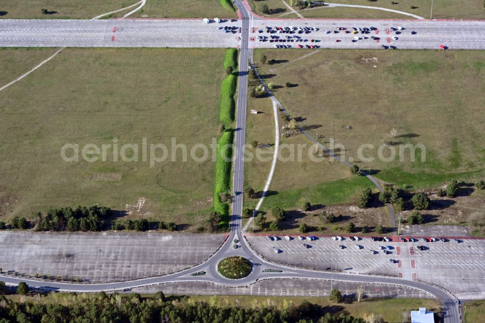 Krausnick from the bird's eye view: Parking areas on the runways of the former airfield Briesen-Brand at the Theme Park Tropical Islands on street Tropical-Islands-Allee in Krausnick in the state of Brandenburg, Germany