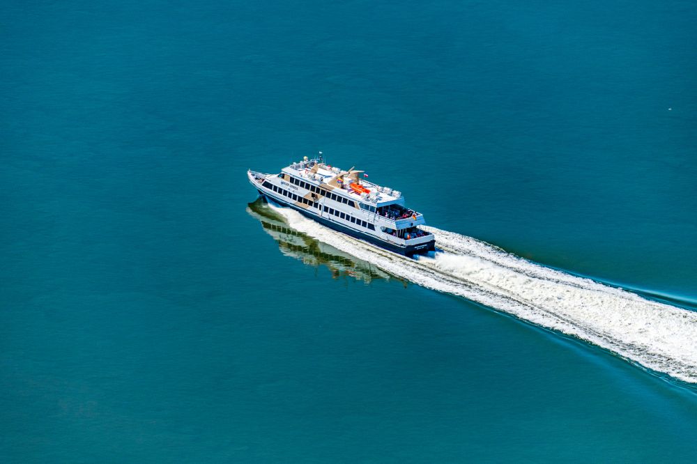 Nordstrand from above - Passenger ship Adler Express at full speed near the peninsula Nordstrand in the Wadden Sea in the state Schleswig-Holstein, Germany