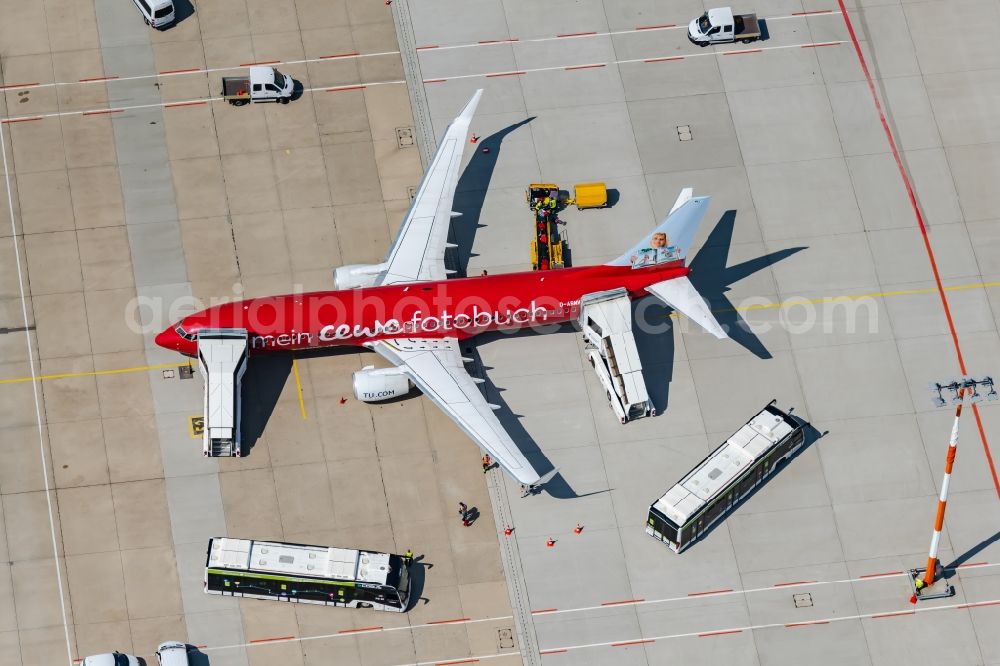 Aerial photograph Stuttgart - Passenger airplane D-ABMV of the TUI Airlines in parking position - parking area at the airport in Stuttgart in the state Baden-Wuerttemberg, Germany