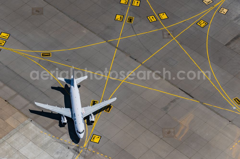 Leinfelden-Echterdingen from the bird's eye view: Passenger aircraft Airbus A319 of the romanian airline Just US Air with the registration YR-URS on the take-off position at Stuttgart Airport in Leinfelden-Echterdingen in the state Baden-Wuerttemberg, Germany