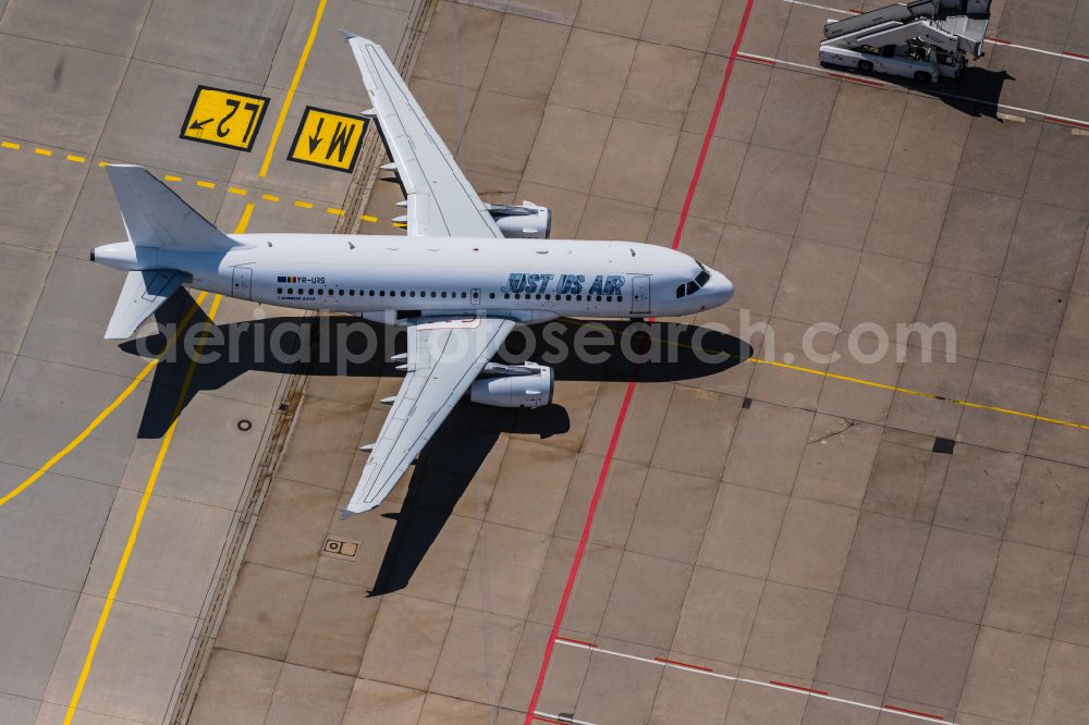 Aerial image Leinfelden-Echterdingen - Passenger aircraft Airbus A319 of the romanian airline Just US Air with the registration YR-URS on the take-off position at Stuttgart Airport in Leinfelden-Echterdingen in the state Baden-Wuerttemberg, Germany
