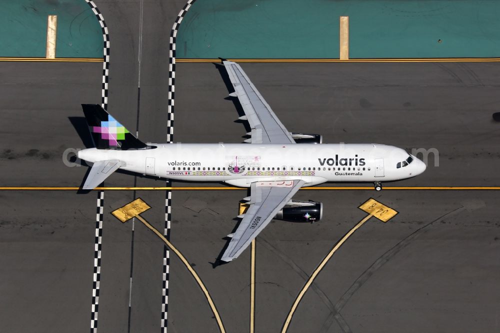 Aerial photograph Los Angeles - Passenger aircraft Airbus A320 of the airline Volaris taxis at the international airport in Los Angeles in California, United States of America