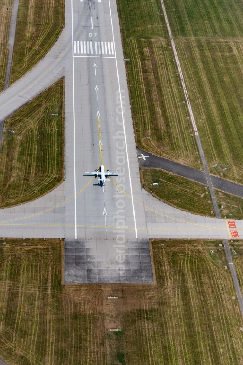 Aerial photograph Filderstadt - Airliner - Passenger aircraft at the start and climb over the airport in Filderstadt in the state Baden-Wurttemberg, Germany