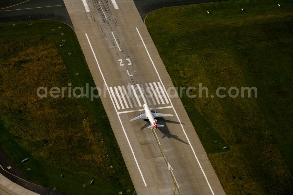 Düsseldorf from above - Airliner - Passenger aircraft at the start and climb over the airport in the district Lohausen in Duesseldorf in the state North Rhine-Westphalia, Germany