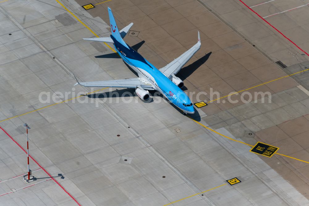 Leinfelden-Echterdingen from above - Passenger aircraft Boeing 737-8K5 D-ATUO of the airline TUI taxiing on the tarmac and apron of the airport in Stuttgart in the state Baden-Wuerttemberg, Germany