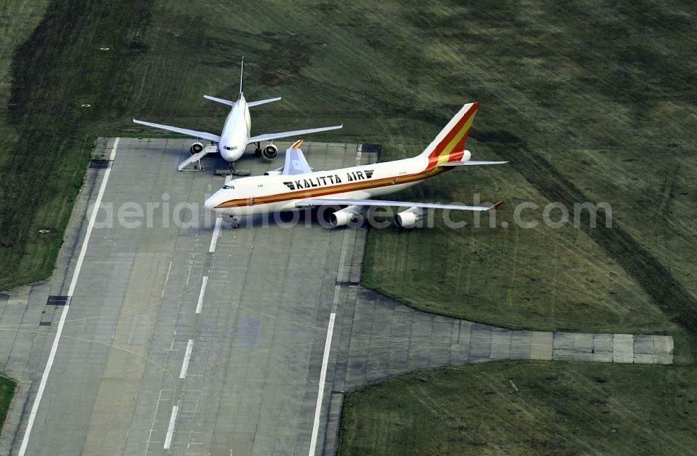 Schkeuditz from the bird's eye view: Passenger airplane Boeing 747-4B5F(SCD) of Kalitta Air with of sign N710CK in parking position - parking area at the airport in Schkeuditz in the state Saxony, Germany