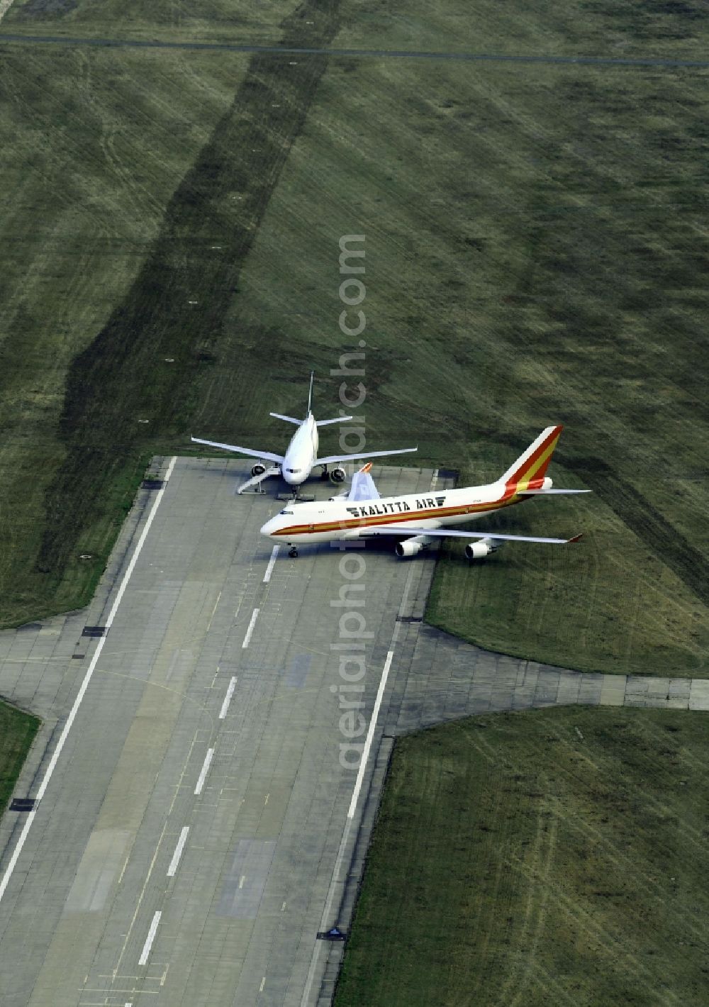 Aerial image Schkeuditz - Passenger airplane Boeing 747-4B5F(SCD) of Kalitta Air with of sign N710CK in parking position - parking area at the airport in Schkeuditz in the state Saxony, Germany