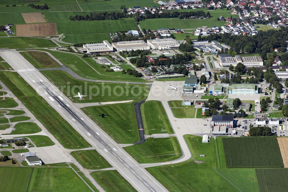 Aerial image Memmingerberg - Airliner - Passenger aircraft A320 von Eurowings at the start and climb over the airport on street Am Flughafen in Memmingerberg in the state Bavaria, Germany