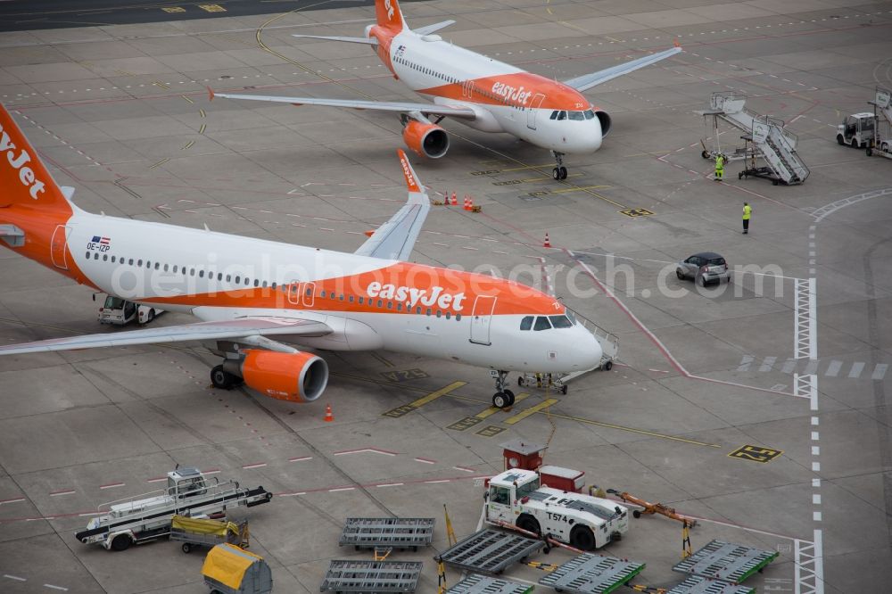 Berlin from above - Passenger airplane of airline easyJet in parking position - parking area at the airport in Berlin, Germany