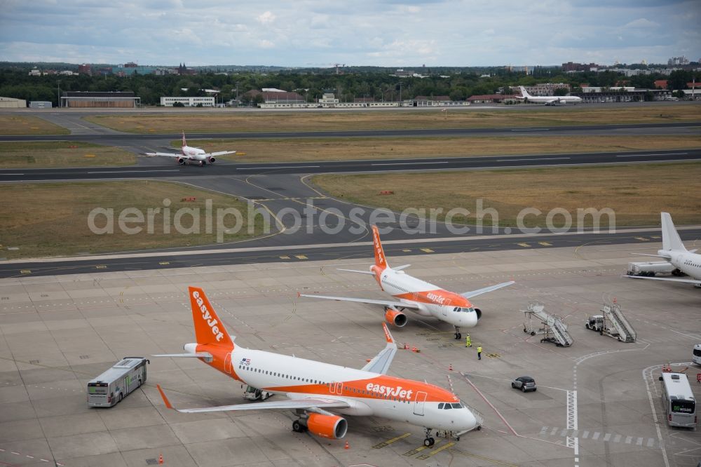 Aerial image Berlin - Passenger airplane of airline easyJet in parking position - parking area at the airport in Berlin, Germany