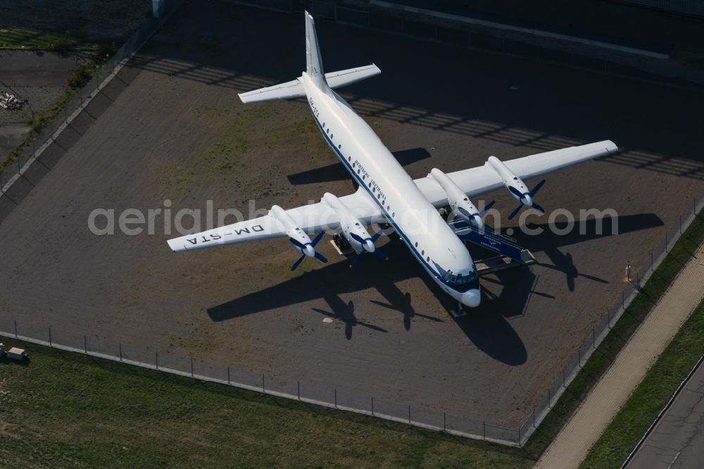 Aerial photograph Schkeuditz - Passenger airplane Iljuschin IL-18 with the identifier DM-STA in parking position - parking area at the airport in Schkeuditz in the state Saxony, Germany