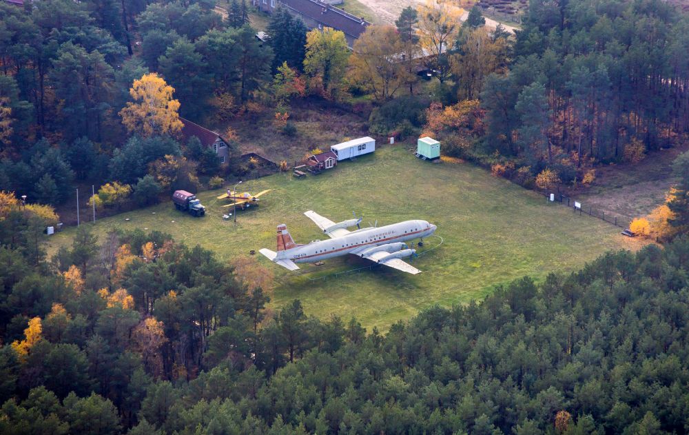 Borkheide from the bird's eye view: Passenger aircraft Ilyushin IL-18 with the registration DDR-STE of the former East German airline INTERFLUG on the exhibition grounds of the Hans Grade Museum on Postweg in Borkheide in the state of Brandenburg