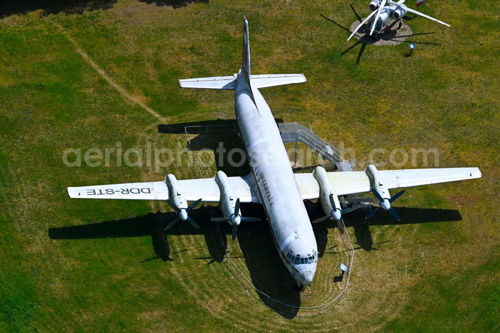 Borkheide from the bird's eye view: Passenger aircraft Ilyushin IL-18 with the registration DDR-STE of the former East German airline INTERFLUG on the exhibition grounds of the Hans Grade Museum on Postweg in Borkheide in the state of Brandenburg