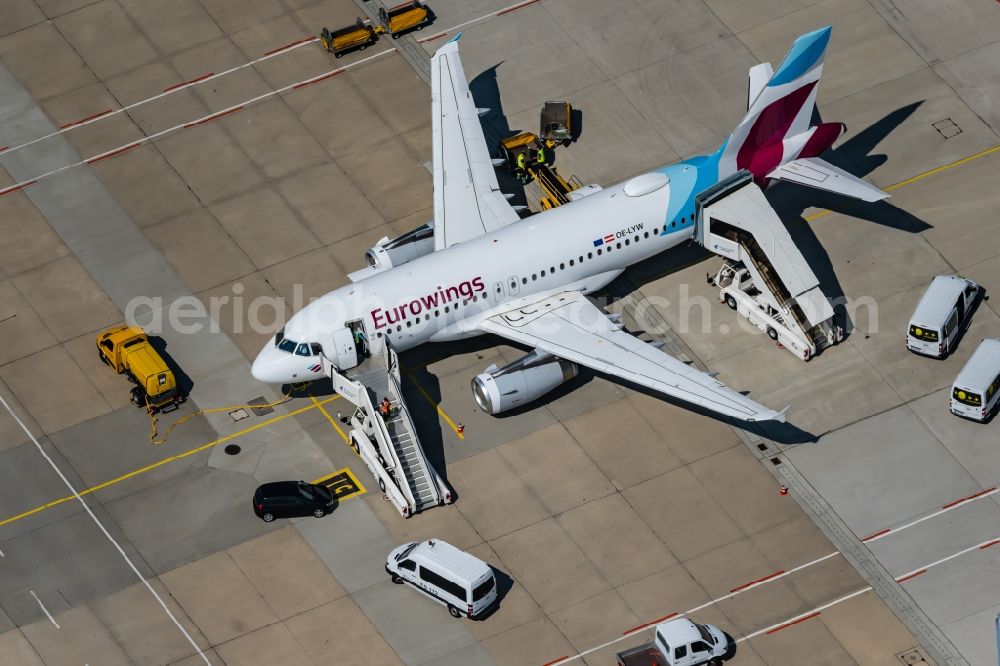 Stuttgart from above - Passenger airplane OE-LYW from Eurowings in parking position - parking area at the airport in Stuttgart in the state Baden-Wuerttemberg, Germany