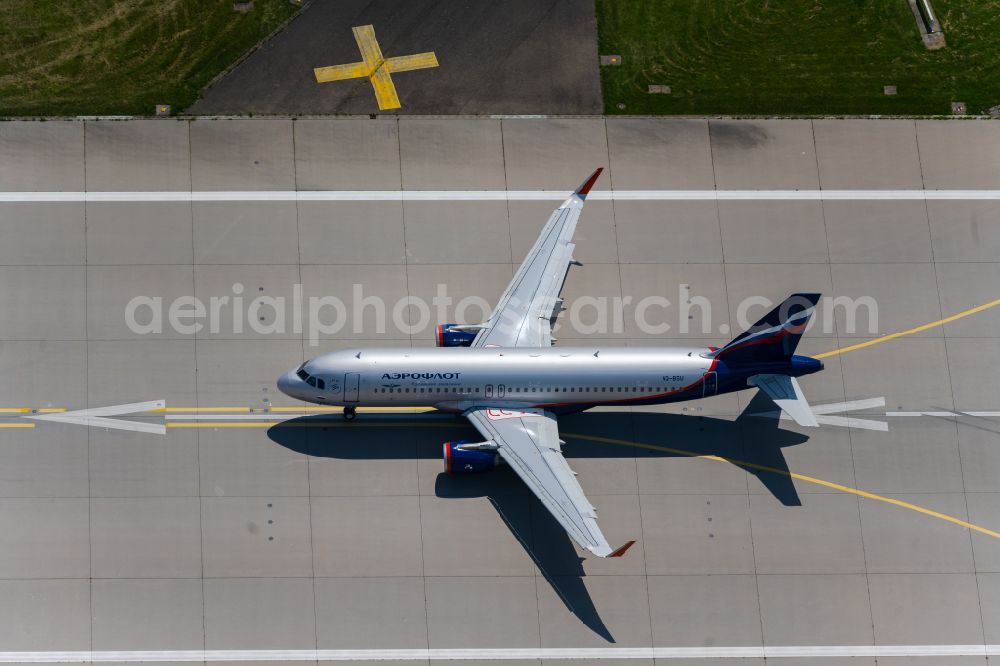 Filderstadt from above - Passenger aircraft of the Russian airline Aeroflot of the type Airbus A320-200 with the registration VQ-BSU taking off at Stuttgart Airport in Filderstadt in the state Baden-Wuerttemberg, Germany