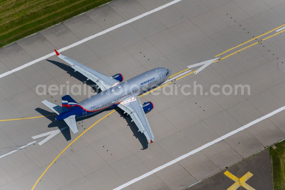 Aerial photograph Filderstadt - Passenger aircraft of the Russian airline Aeroflot of the type Airbus A320-200 with the registration VQ-BSU taking off at Stuttgart Airport in Filderstadt in the state Baden-Wuerttemberg, Germany