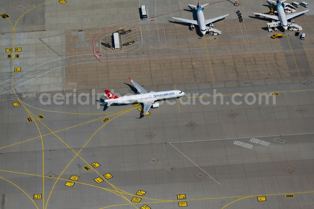 Stuttgart from above - Airliner- Passenger aircraft of Turkish Airlines rolling on the apron of the airport in Stuttgart in the state Baden-Wuerttemberg, Germany