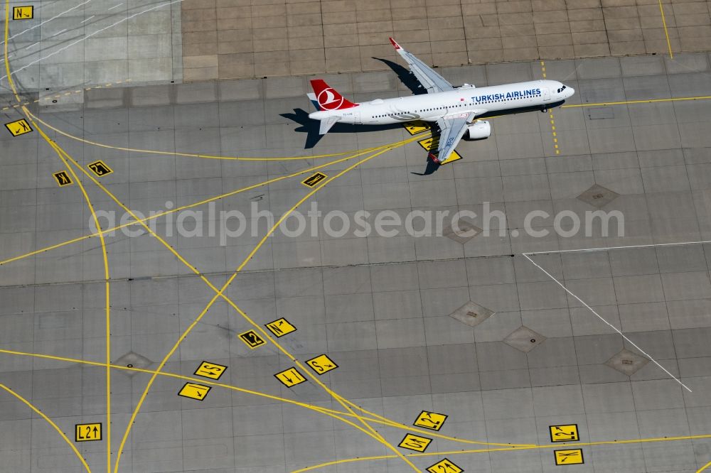 Stuttgart from the bird's eye view: Airliner- Passenger aircraft of Turkish Airlines rolling on the apron of the airport in Stuttgart in the state Baden-Wuerttemberg, Germany