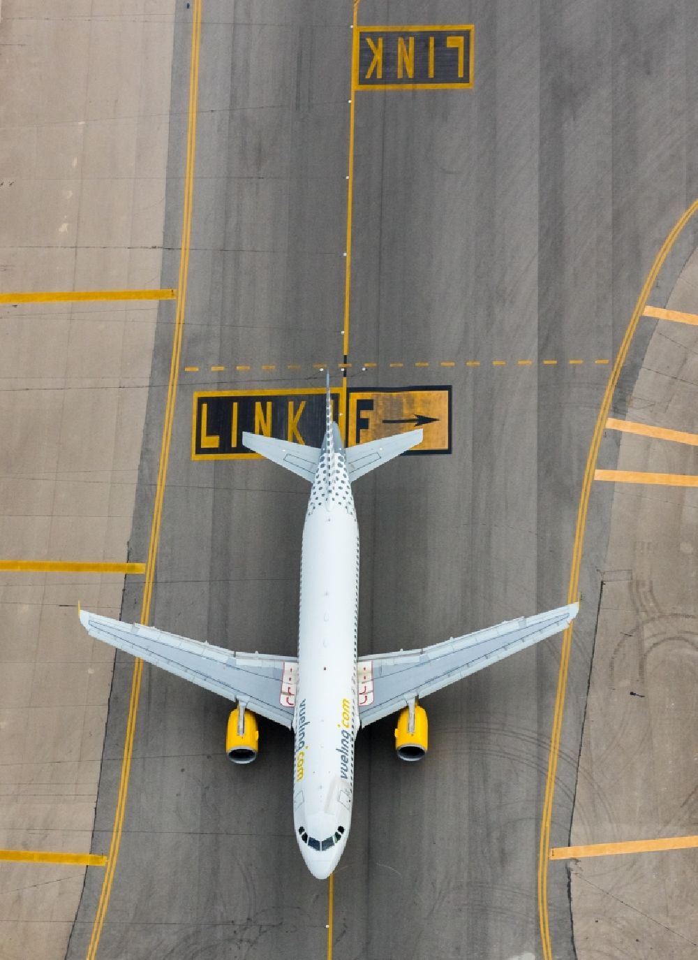 Aerial image Palma - Passenger airplane of VUELING AIRLINES S.A. in parking position - parking area at the airport in the district Llevant de Palma District in Palma in Balearische Insel Mallorca, Spain