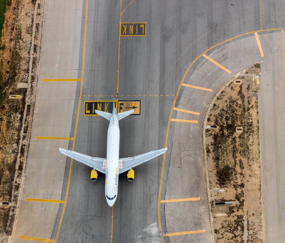 Aerial photograph Palma - Passenger airplane of VUELING AIRLINES S.A. in parking position - parking area at the airport in the district Llevant de Palma District in Palma in Balearische Insel Mallorca, Spain