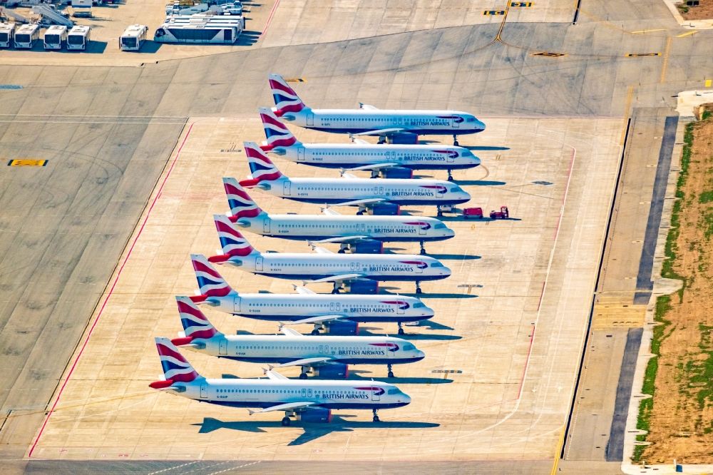 Aerial image Palma - Passenger airplane Airbus Airbus A320-232 of airline Britisch Airways in pandemic parking position - parking area at the airport in the district Llevant de Palma District in Palma in Islas Baleares, Spain