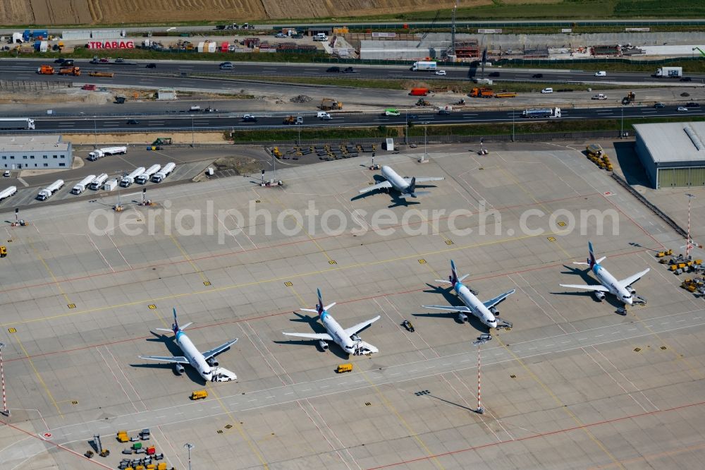 Stuttgart from the bird's eye view: Passenger airplanes from Eurowings in parking position - parking area at the airport in Stuttgart in the state Baden-Wuerttemberg, Germany