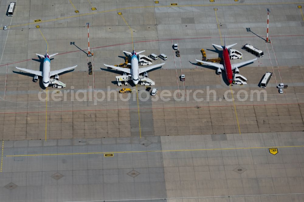 Aerial image Stuttgart - Passenger airplanes from Eurowings in parking position - parking area at the airport in Stuttgart in the state Baden-Wuerttemberg, Germany
