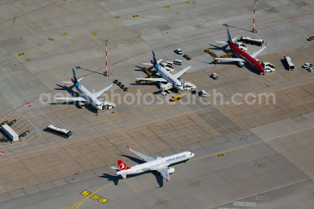 Aerial photograph Stuttgart - Passenger airplanes from Eurowings in parking position - parking area at the airport in Stuttgart in the state Baden-Wuerttemberg, Germany