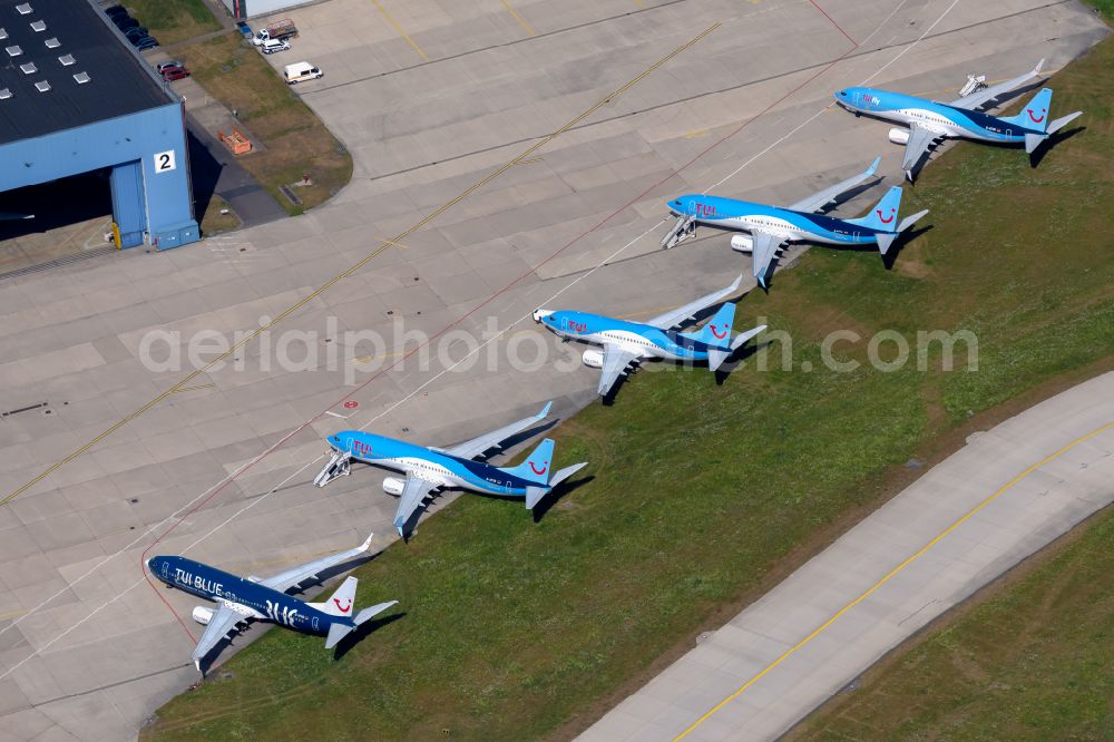 Langenhagen from above - Passenger airplane of the Fluggesellschaft TUI of Typs Boeing 737 in parking position - parking area at the airport in Langenhagen in the state Lower Saxony, Germany