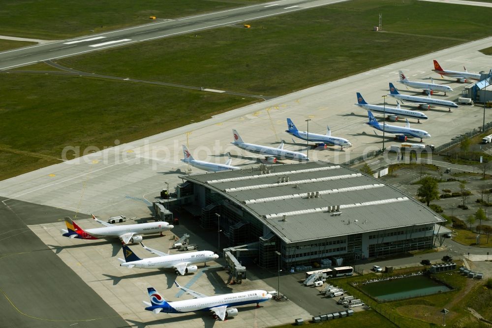 Aerial image Laage - Brand new Airbus A321-253NX passenger aircraft parked for export to China - parked due to the crisis - parking space at the airport in Laage in the state of Mecklenburg-West Pomerania, Germany