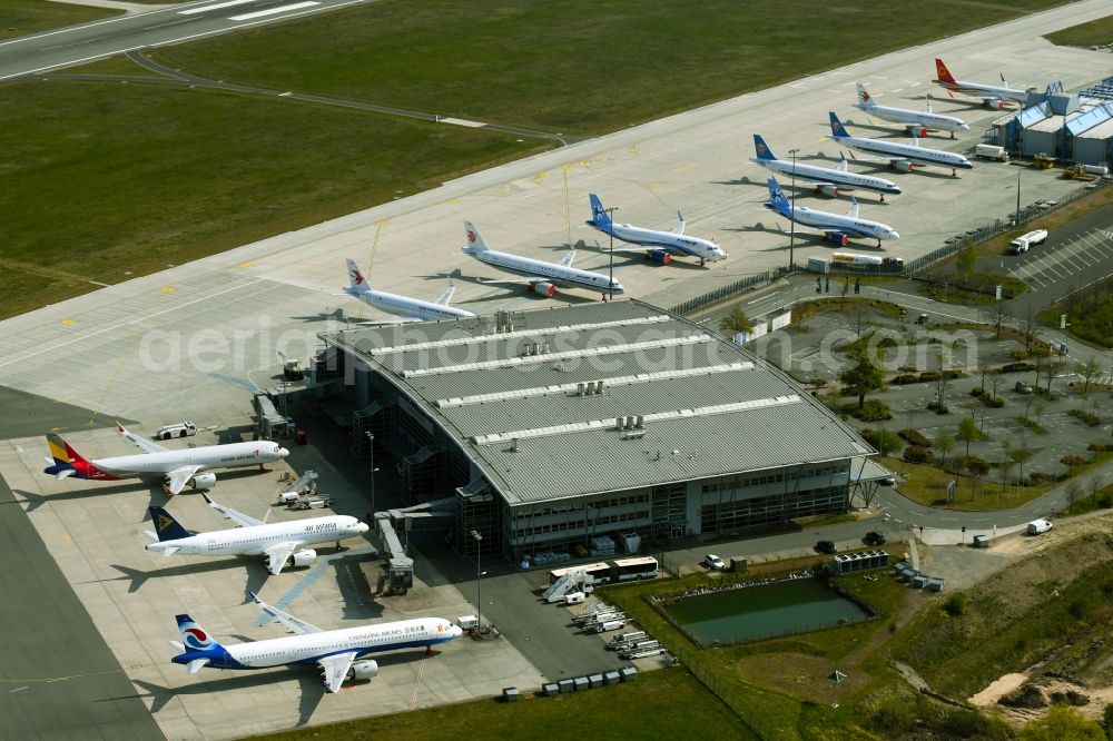 Aerial photograph Laage - Brand new Airbus A321-253NX passenger aircraft parked for export to China - parked due to the crisis - parking space at the airport in Laage in the state of Mecklenburg-West Pomerania, Germany