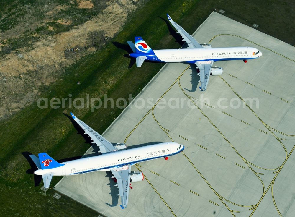 Aerial photograph Laage - Brand new Airbus A321-253NX passenger aircraft parked for export to China - parked due to the crisis - parking space at the airport in Laage in the state of Mecklenburg-West Pomerania, Germany