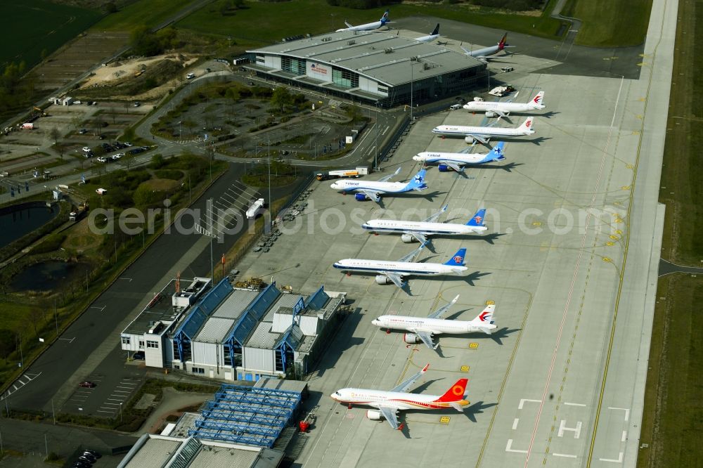 Aerial image Laage - Brand new Airbus A321-253NX passenger aircraft parked for export to China - parked due to the crisis - parking space at the airport in Laage in the state of Mecklenburg-West Pomerania, Germany