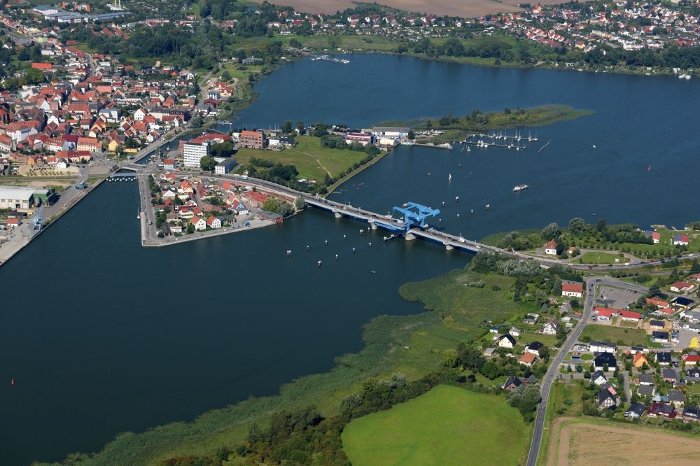 Wolgast from above - View of the Peene Bridge in Wolgast in the state Mecklenburg-Vorpommern. The Peene Bridge is a bascule bridge and crosses the Peenestream. The bridge bears the name Bridge of friendship