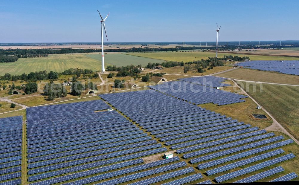 Zerbst/Anhalt from the bird's eye view: Zerbst airfield and solar power plant - photovoltaic park and wind farm on the open spaces of Zerbst airfield in the state of Saxony-Anhalt