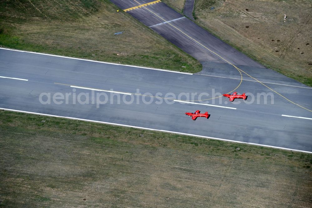 Lübeck from the bird's eye view: Passenger aircraft Pilatus PC 7 at the start on runway of airport in the district Blankensee in Luebeck in the state Schleswig-Holstein, Germany