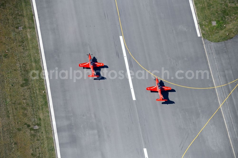 Aerial photograph Lübeck - Passenger aircraft Pilatus PC 7 at the start on runway of airport in the district Blankensee in Luebeck in the state Schleswig-Holstein, Germany
