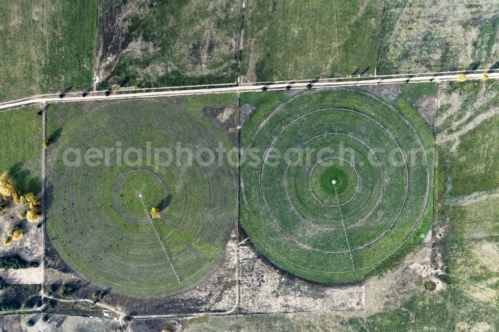 Prescott from above - Circular round arch of a pivot irrigation system on agricultural fields in Prescott in Arizona, United States of America